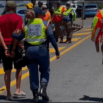 Eastern Cape Traffic Officials Escorting An Arrested Motorist During A Road Block Picture By ECDoT