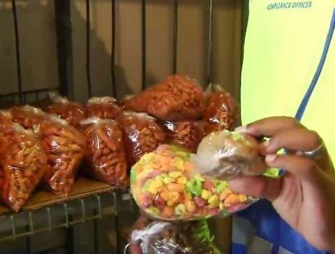 Packaged snacks displayed during a food safety inspection following a suspected food poisoning incident in the Eastern Cape.