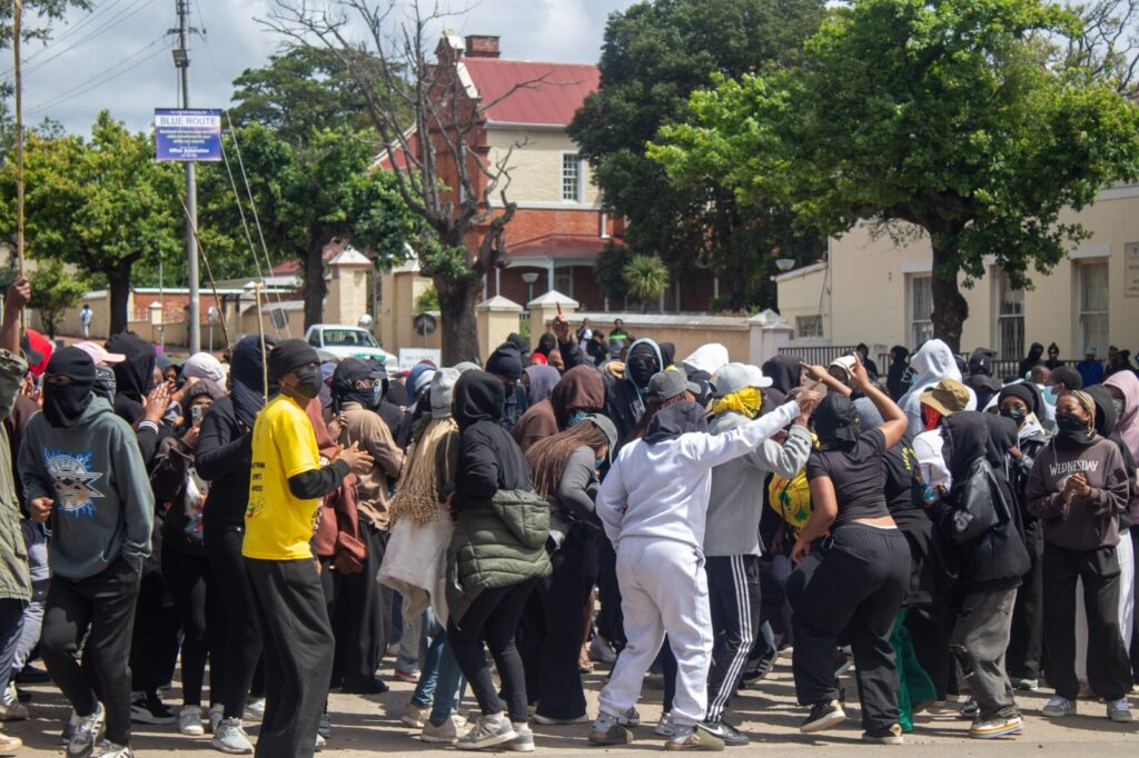 Rhodes University students gather near a campus entrance during a protest over the 2027 student fees protocol.