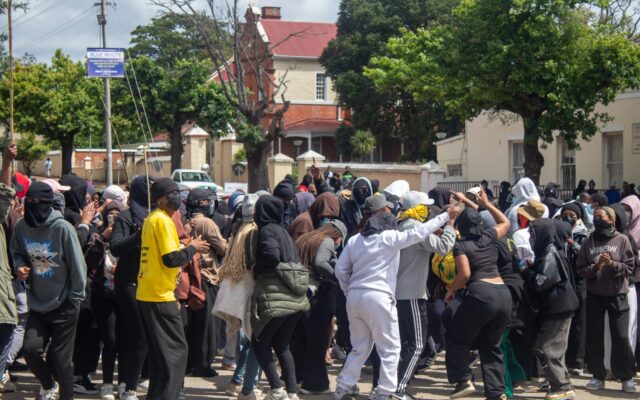 Rhodes University students gather near a campus entrance during a protest over the 2027 student fees protocol.