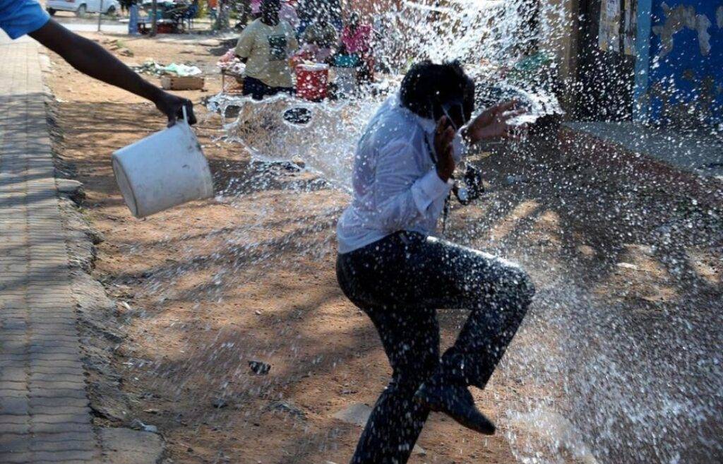 Young people splashing water during Spring Day celebrations in Gauteng.